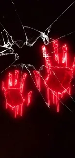 Neon red handprints on shattered black glass wallpaper.