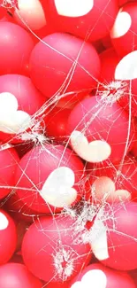 Red balls with white heart pattern, vibrant mobile wallpaper.