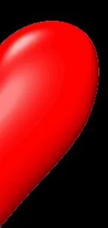 A vibrant red heart on a black background.