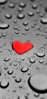 Red heart with water droplets on a gray background.