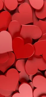 Mobile wallpaper of scattered red hearts with a 3D effect.