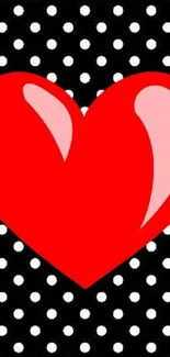 Red heart on black and white polka dot background wallpaper.