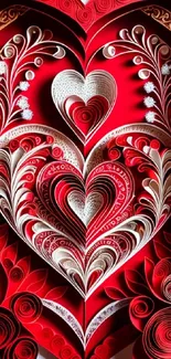 Intricate red quilling heart art on mobile wallpaper.