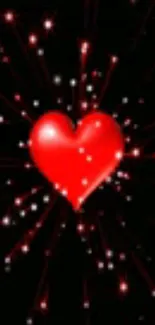 A vivid red heart with sparkles on a black background wallpaper.