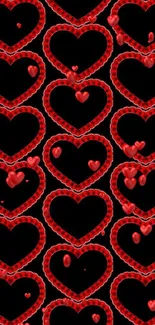 Mobile wallpaper with red hearts on a black background.