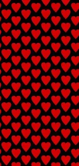 Mobile wallpaper with red heart pattern on black background.