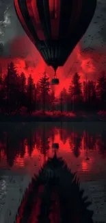 Red hot air balloon over forest and lake at dusk.