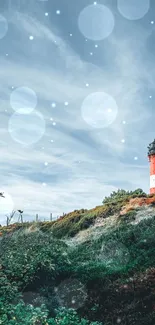 Lighthouse standing on a hill under a cloudy sky, with lush greenery surrounding.