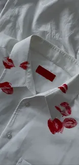 White shirt with red lipstick print design.