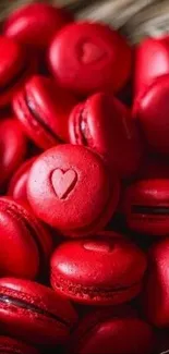 Red macarons with heart patterns in elegant arrangement.