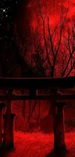 Red moon illuminating a Torii gate in a mystical night setting.