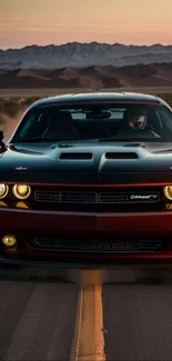 Dodge Challenger speeding on desert road at sunset.