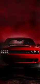 Front view of a red muscle car shrouded in dark foggy atmosphere.