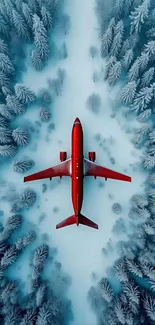 A red plane flies over a snow-covered forest landscape, viewed from above.