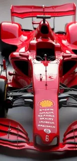 Red Formula One car front view.