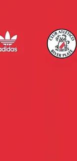 Red mobile wallpaper with River Plate and Adidas logos.