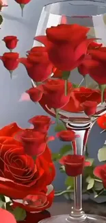 Elegant arrangement of red roses inside a wine glass, creating floral art.