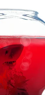 Shark silhouette in red liquid bowl, striking and vibrant.