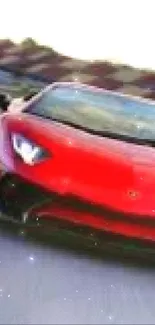 Red sports car driving on race track, front view.