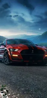 A red sports car on a scenic roadside at night.