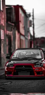 Red sports car parked on a city street, perfect for mobile wallpaper.