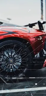 Vibrant red sports car with intricate wheel detail.