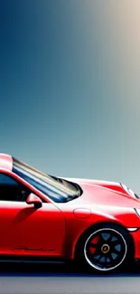 Sleek red sports car with gradient backdrop.