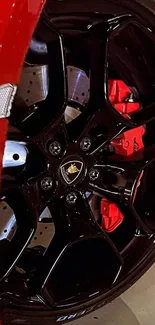 Close-up of a red sports car wheel with a detailed brake system.