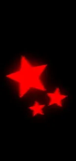 Mobile wallpaper with glowing red stars on a black background.