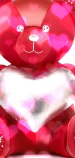 Red teddy bear holding a silver heart with stylish accents.