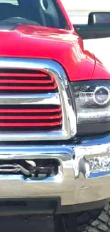 Front view of a red truck with chrome accents, perfect for mobile wallpaper.