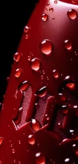 Close-up of red surface with water droplets.