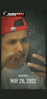 Mobile wallpaper showing a young man taking a selfie, emphasizing reflection and memories.