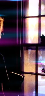 Person looking out a window at sunset with neon light accents.