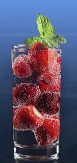 Glass with berries and mint in water on a blue background wallpaper.