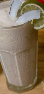 Vertical image of a coconut lime drink with garnishes.