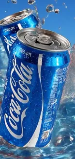 Blue soda cans splashing in water with a vibrant background.
