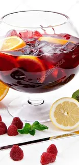 Vibrant sangria with fruits and ice in a glass bowl