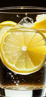 Lemon slices splashing in a clear glass with water