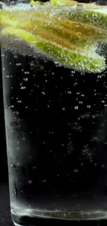 Mobile wallpaper of lime slice in sparkling water with bubbles.