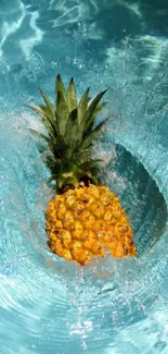 Vibrant pineapple splashing into clear blue water, creating a tropical effect.