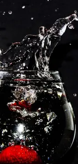 Strawberry splash in glass on black background.