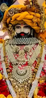 Richly adorned deity statue with vibrant colors and intricate details.