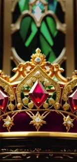 Regal gold crown with red jewels on a royal background.