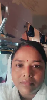 Portrait of a woman relaxing on a bus ride.