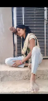 Woman resting on porch, relaxing in serene pose.