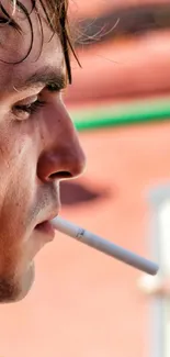 Close-up of a person outdoors enjoying summer with vibrant, sunlit background.