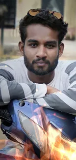 Man relaxing on motorcycle with urban backdrop.