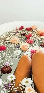 Relaxing floral bath with roses and petals for a serene phone wallpaper.