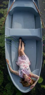 Woman relaxing in a boat surrounded by green lily pads.